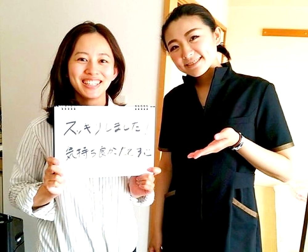 お客様とセラピストのホワイトボード写真